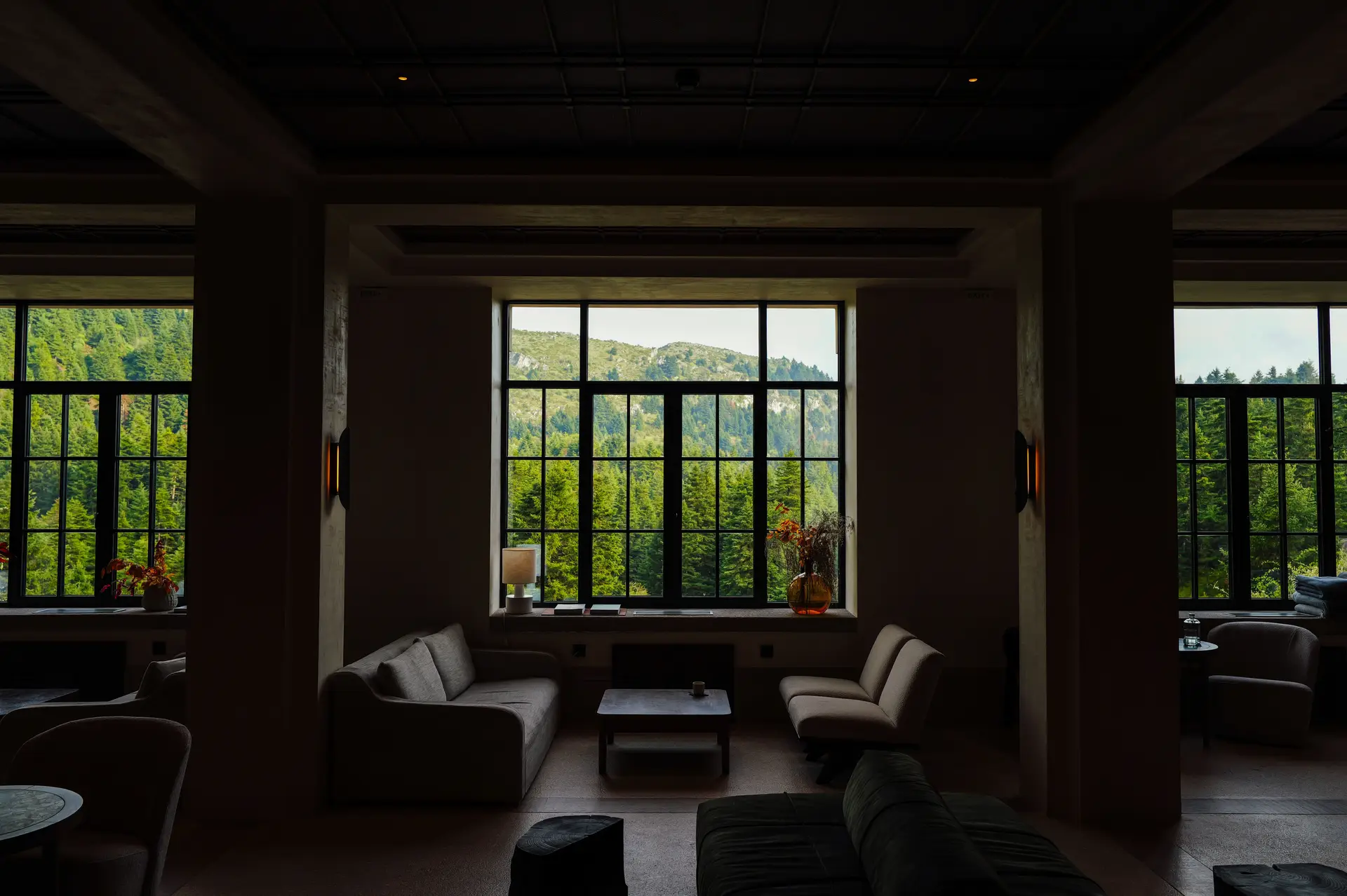 Elegant lounge interior with a breathtaking scenic countryside view through large windows