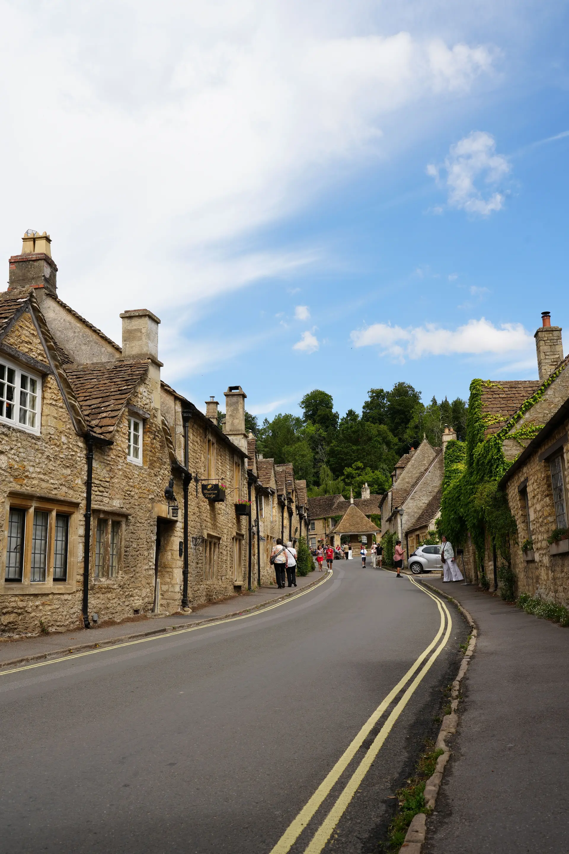 Stone cottages along an English river in Castle Combe
