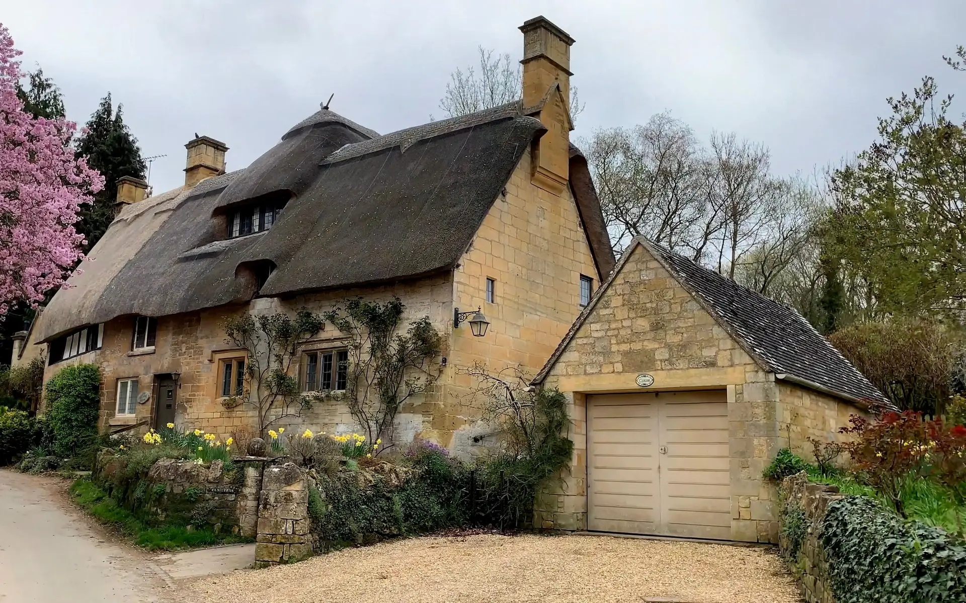 Thatched stone cottage in historic Cotswolds village