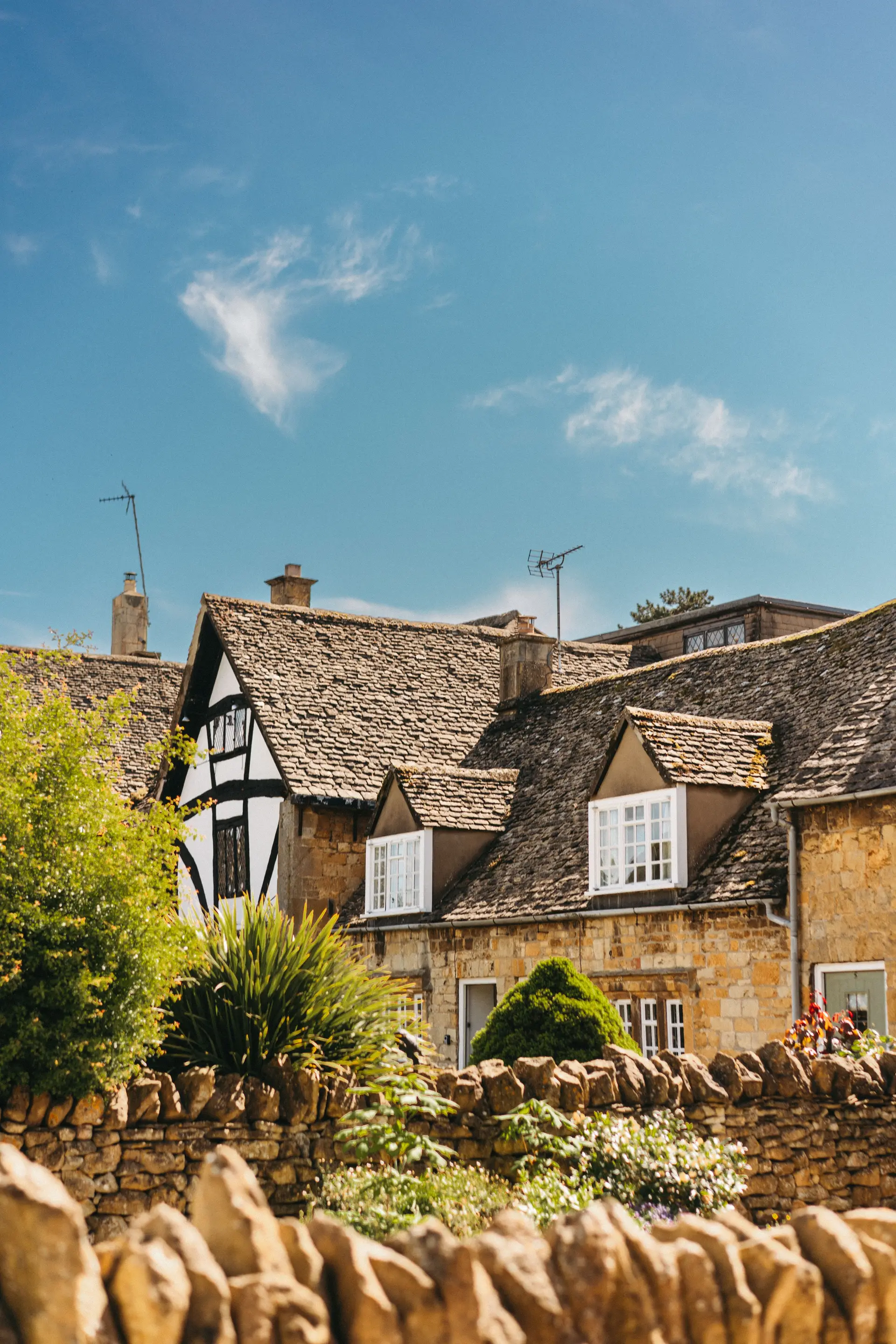 Secluded stone cottage covered in ivy in the English countryside
