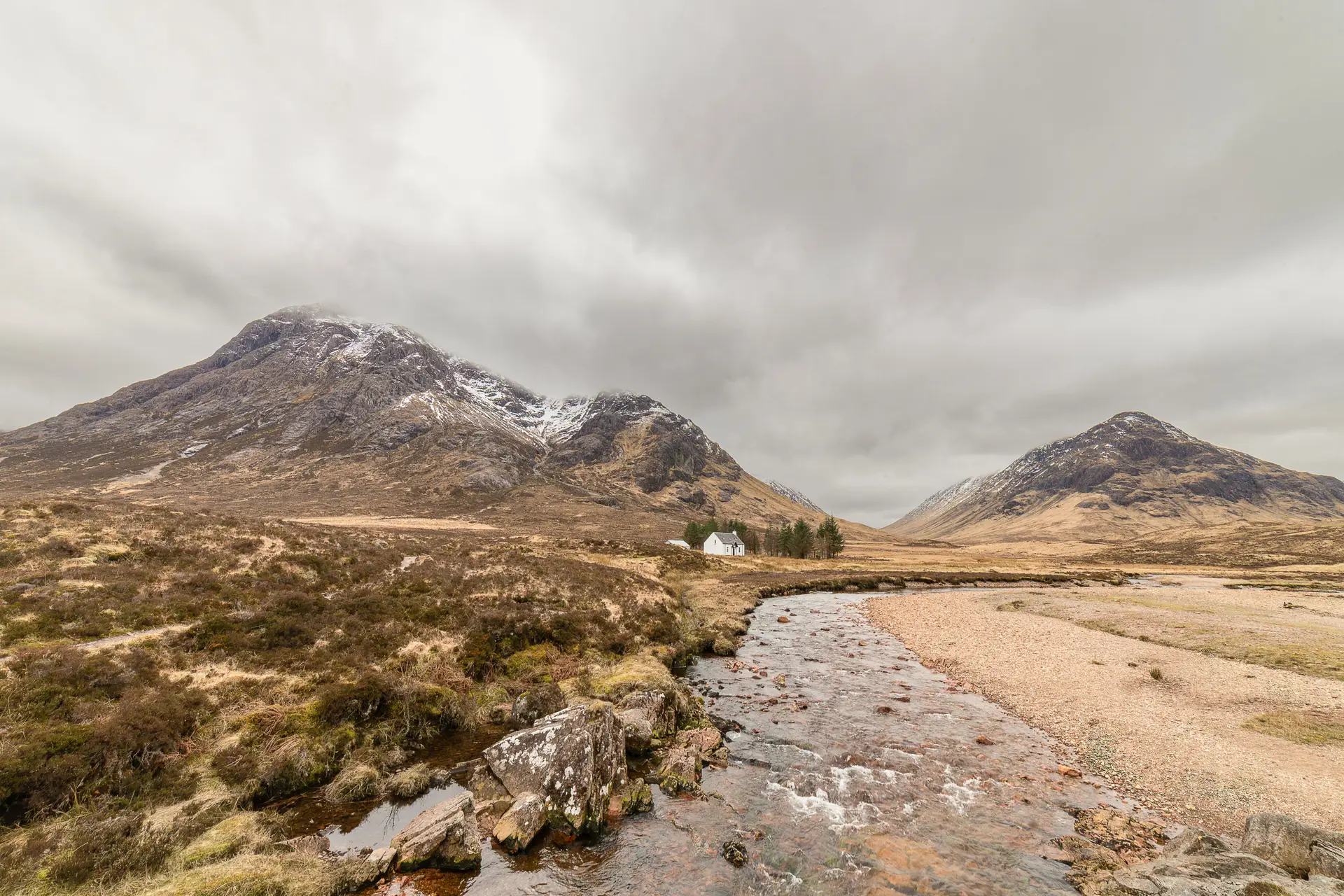 Dramatic valley and cloud-swept crags in Glencoe, Scotland